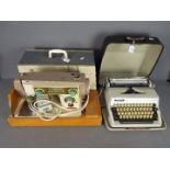 A vintage Novum Deluxe Mark X electric sewing machine in carry case and an Adler Gabriele 25