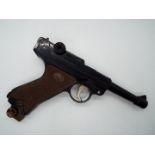 A vintage Japanese airsoft gun in the form of a Luger, model 72, by Falcon.