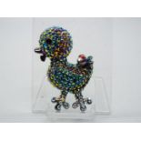 Butler & Wilson - a Butler & Wilson multicoloured stone set brooch in the form of a duckling,