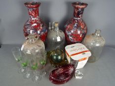 A mixed lot of glassware to include an art glass bowl, cranberry cut to clear bowl,