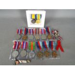 A collection of medals and similar.