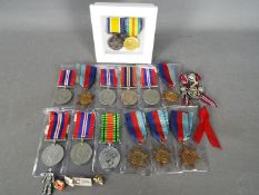 A collection of medals and similar.