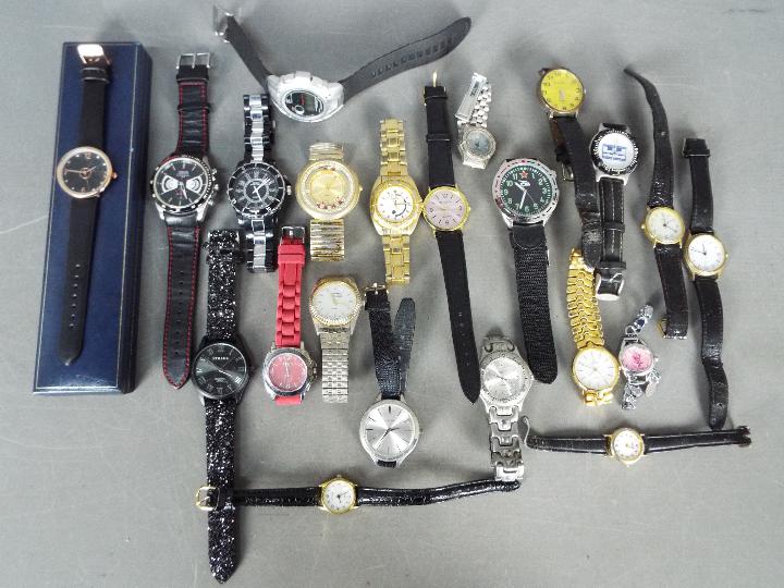 A collection of modern wristwatches and similar, lady's and gentleman's.