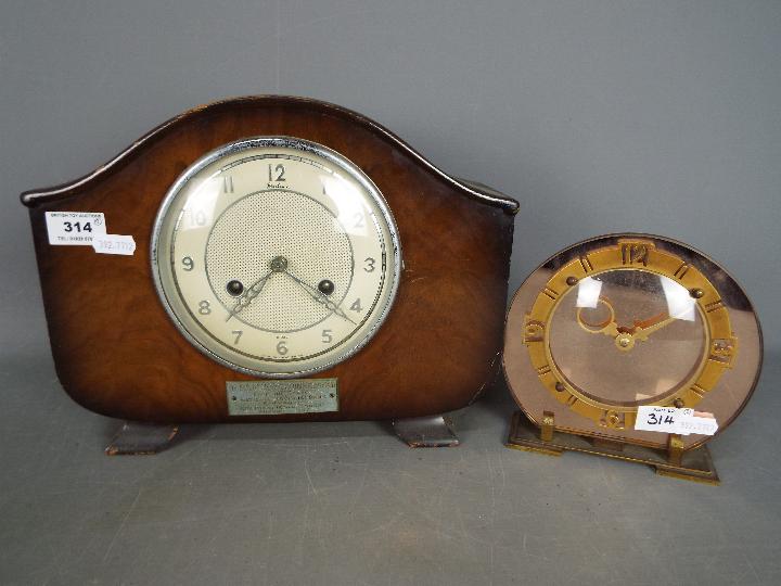 A Bentima oak cased, 8 day mantel clock, with pendulum and one other clock.