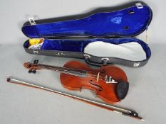 Violin - An early 20th century violin, two piece back,