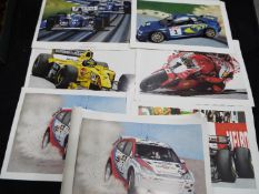A collection of motor sport related posters and prints.
