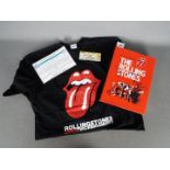 A signed copy of According To The Rolling Stones, signed to the dust jacket and an internal page,