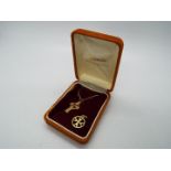 A 9ct gold crucifix pendant and chain (46 cm length) and a 9ct gold Maltese Cross pendant,