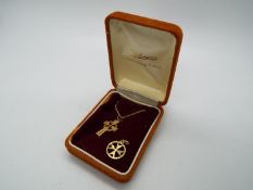 A 9ct gold crucifix pendant and chain (46 cm length) and a 9ct gold Maltese Cross pendant,