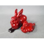 Two Royal Doulton flambe figures comprising a duck and a rabbit, largest approximately 7 cm (h).