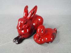 Two Royal Doulton flambe figures comprising a duck and a rabbit, largest approximately 7 cm (h).