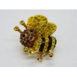 Butler & Wilson - a Butler & Wilson stone set pin in the form of a bee,