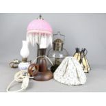 A collection of table lamps, oil lamp, lantern.