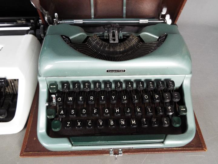 Two portable typewriters, one an Imperial 'Good Companion' and a vintage dial telephone. - Image 3 of 4