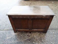 A linen chest with carved decoration, ap