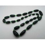 A graduated Malachite green hard stone n