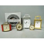 A collection of clocks to include carria
