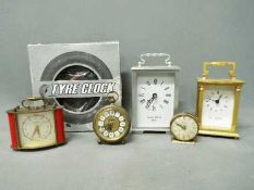 A collection of clocks to include carria