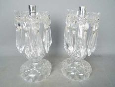 A pair of glass centerpieces. [2]