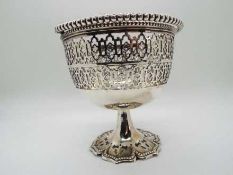 A silver plate pedestal bowl with pierce