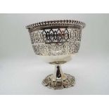 A silver plate pedestal bowl with pierce