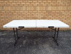 A Lifetime folding trestle table, approximately 70 cm x 180 cm x 76 cm.