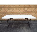 A Lifetime folding trestle table, approximately 70 cm x 180 cm x 76 cm.