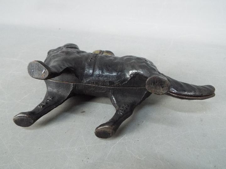 A cast iron money bank in the form of a St Bernard dog, - Image 4 of 8