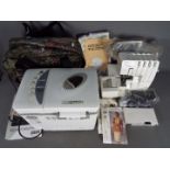 A Brother Lock 929D sewing machine and a Mellerware Home Bakery machine.