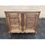 An oak twin door cupboard with faux drawers to the doors, approximately 91 cm x 100 cm x 50 cm.