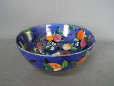 A Wiltshaw & Robinson Carlton Ware bowl decorated in the Orchard pattern with berries,