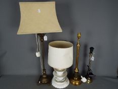 Four table lamps including two by Laura Ashley.