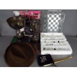 A mixed lot to include Scrabble game, plated trophies, glass chess set,