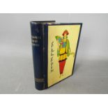 A Chad Valley novelty tinplate money box in the form of a book,