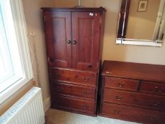 A two door, three drawer cabinet, approximately 140 cm x 72 cm x 50 cm,