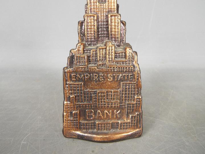 A vintage cast metal money bank of architectural form depicting the Empire State Building, - Image 2 of 5