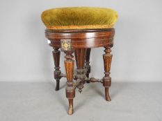 A good quality adjustable piano stool with inlaid decoration, the circular, revolving,