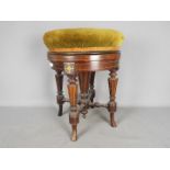 A good quality adjustable piano stool with inlaid decoration, the circular, revolving,