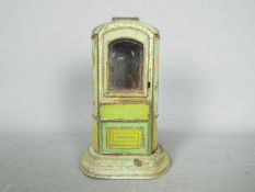 A vintage, German, tinplate chocolate dispenser type money bank c.1930, approximately 15 cm (h).