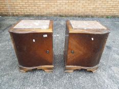 A pair of marble topped bedside cabinets, approximately 55 cm x 45 cm x 38 cm.