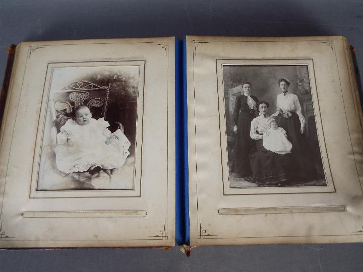 A Victorian, leather bound photograph album with metal clasp, containing photographs. - Image 5 of 10