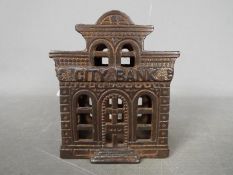 An early 20th century, John Harper, cast iron, money bank 'City Bank', approximately 10 cm (h).