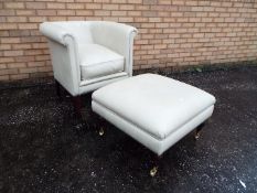 A good quality cream coloured tub chair and matching footstool.