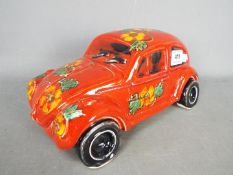 Anita Harris - A large VW Beetle, signed in gold, 12 cm (h) and 28 cm (l).