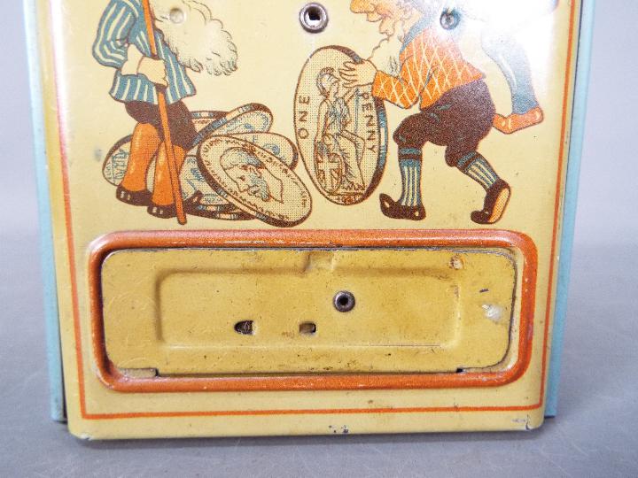 A vintage German, tinplate novelty money bank, one side printed with two children and their mother, - Image 5 of 6