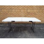 A Lifetime folding trestle table, approximately 70 cm x 180 cm x 76 cm.