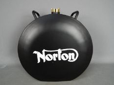 A black Norton petrol can