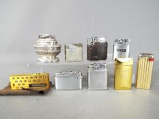 A collection of vintage cigarette lighters to include Ronson, a Satolex calculator lighter, Colibri,
