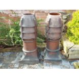 Two glazed louvre vented chimney pots,