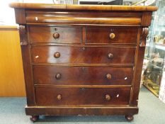 A substantial chest of two over three drawers with upper frieze drawer,